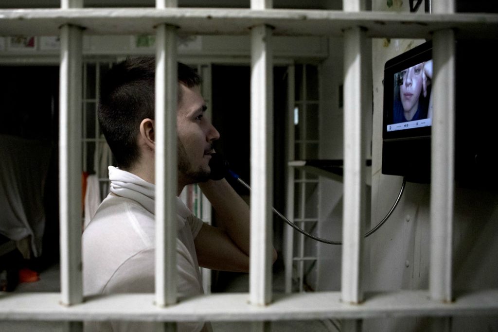Best of Show - Jessica Phelps / Newark Advocate, “Life Locked Up in the County Jail”Dallas Wood speaks with his girlfriend, Justice Dawson while in cell block A at the Coschoton County Justice Center November 18, 2020. The Justice Center has added video cameras that allow inmates to see their loved ones while in jail during the pandemic and in person visits are not allowed. 